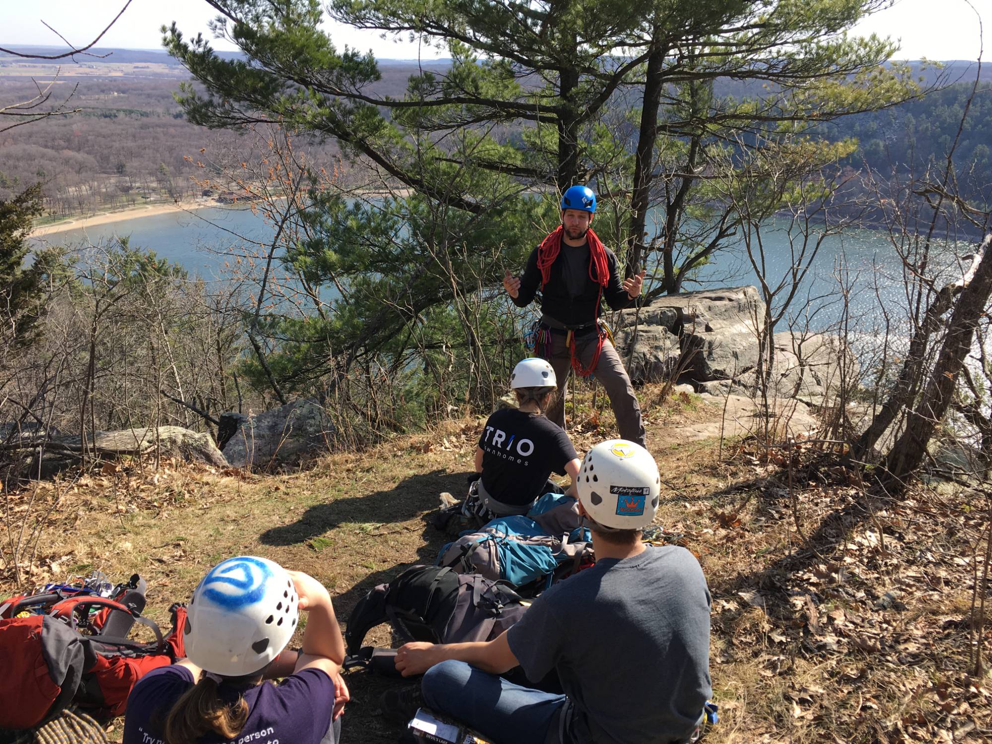 Outdoor climbing instructor overlooking lake